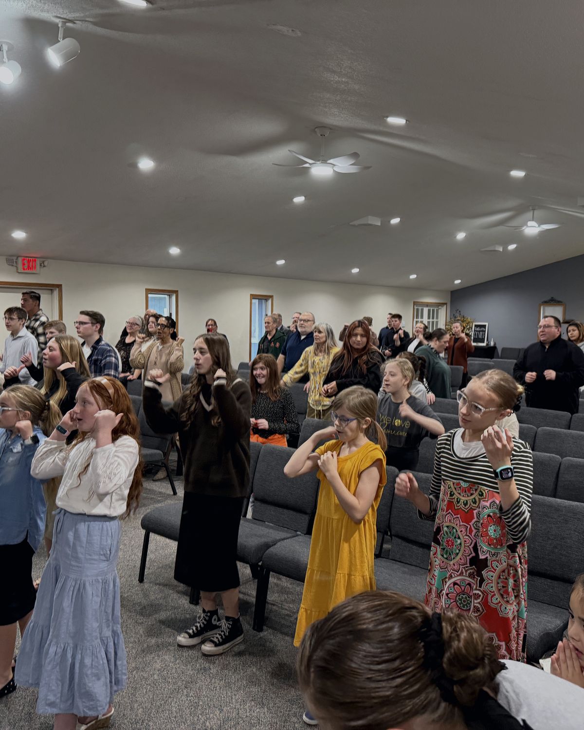 The congregation at Calvary UPC standing together in worship