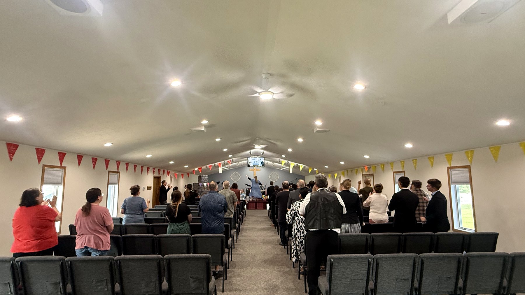 The congregation at Calvary UPC standing in worship